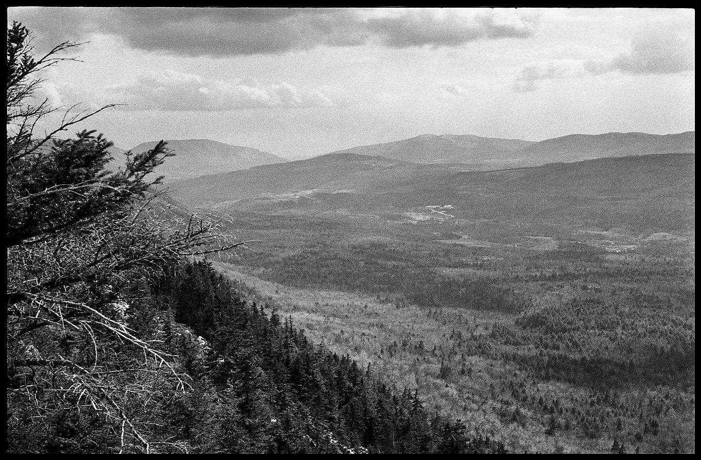 08a.jpg - It was a beautiful spring day.  We climbed over the ice beds and took a break at the base of the cliff, looking out over the valley.  This is a view looking south toward Massachussetts and New York.