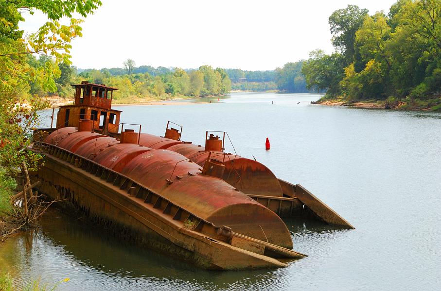 DSC_3100b.jpg - This rusted tug and barge on the Chattahoochee (near Rotary Park) was used to transfer molasses.  When the company went out of business in the 1960's it was just left here. The name of the tugboat is the Scintilla.